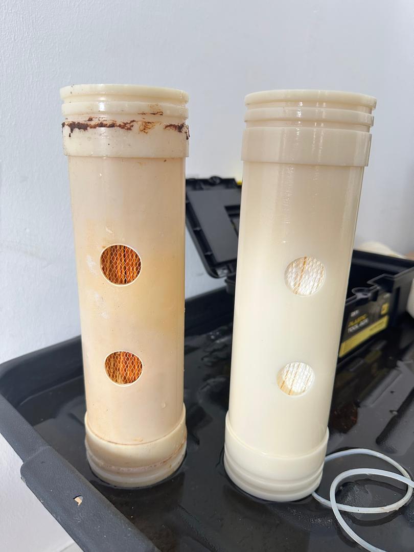 Water filter replacement in progress